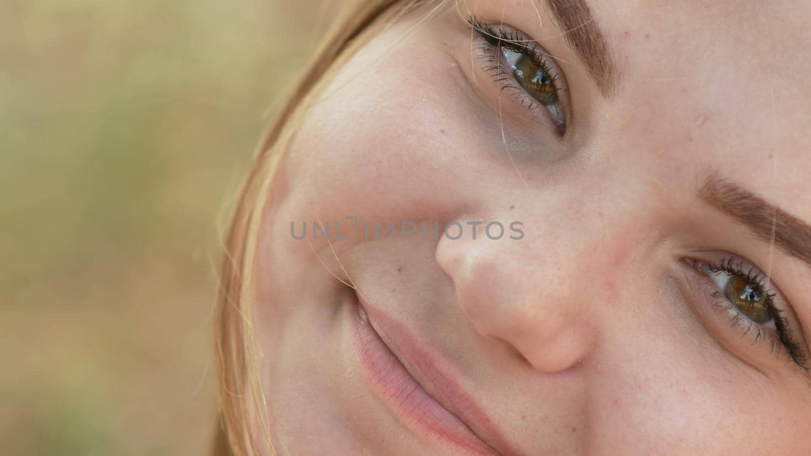 Close up of young smiling girl face. by DovidPro