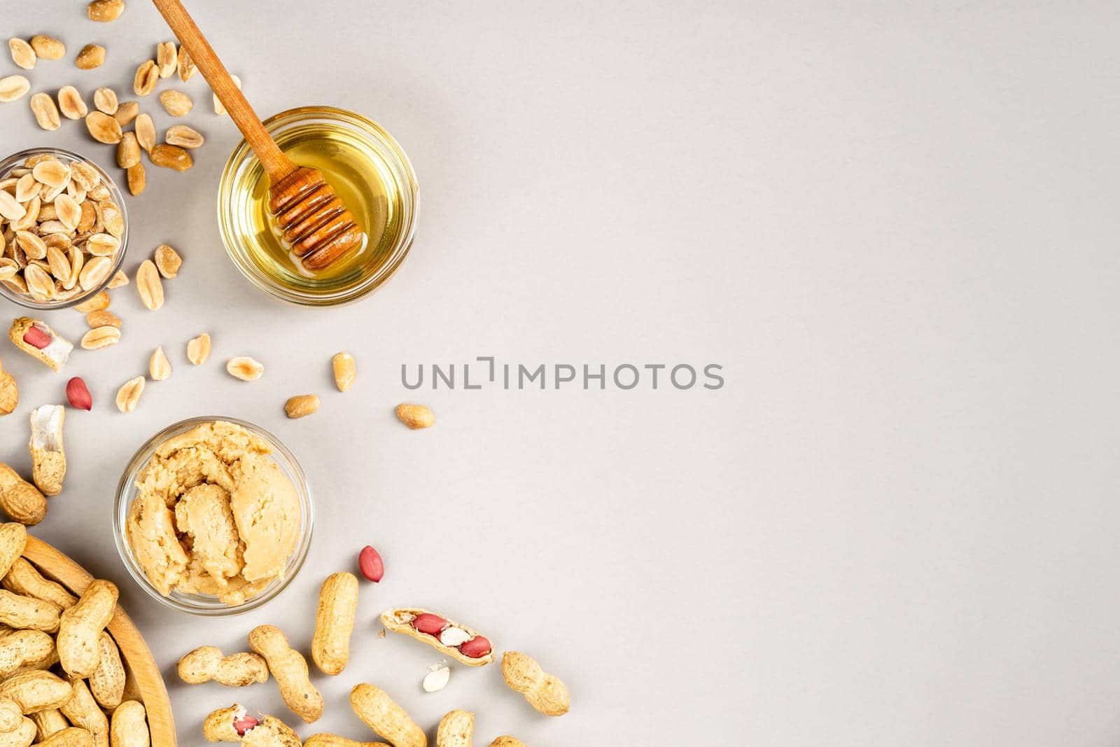 Peanut butter with honey flavour. Flat lay on grey background, copy space for text