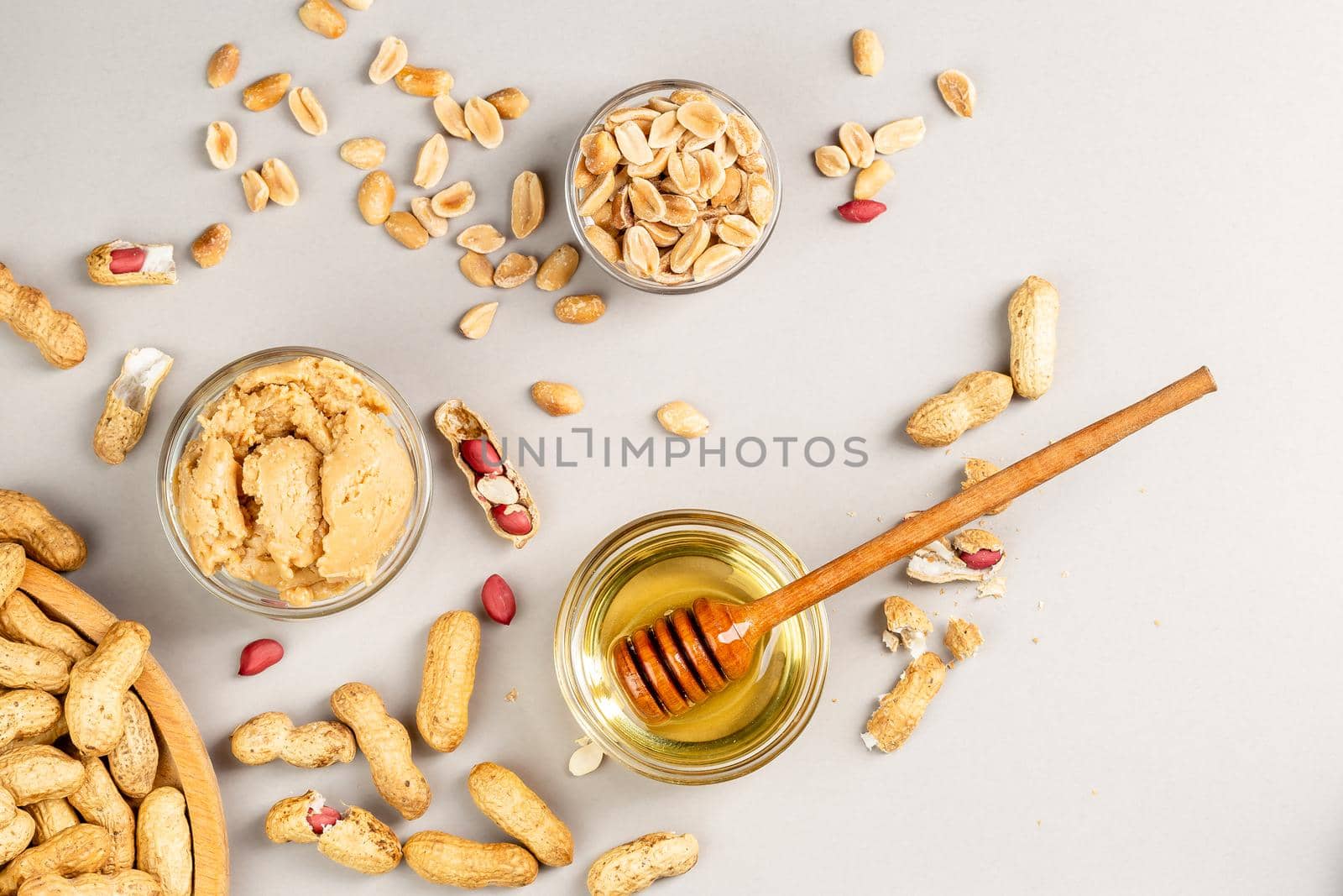 Peanut butter with honey flavour. Flat lay on grey background