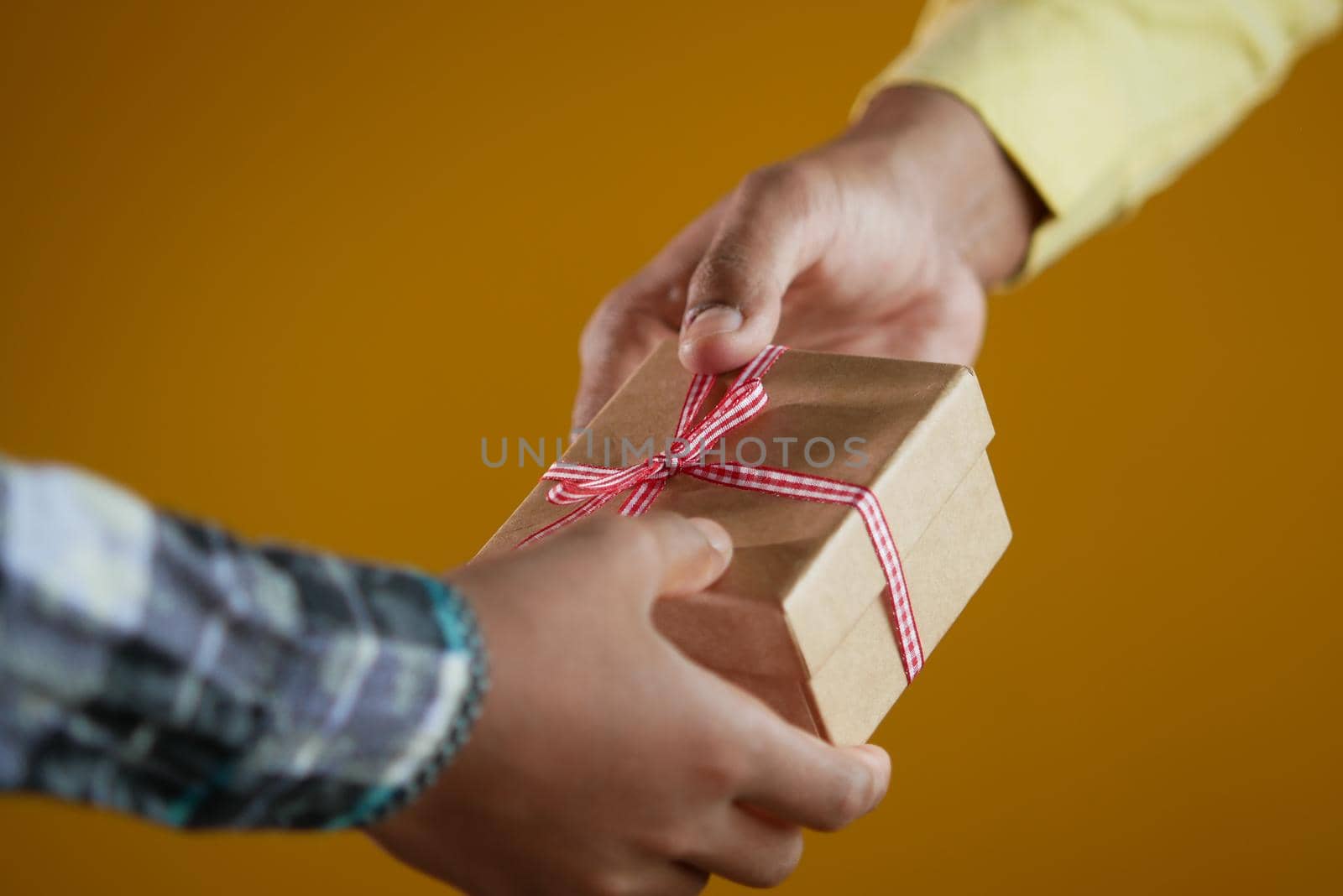 men hand giving homemade gift box .