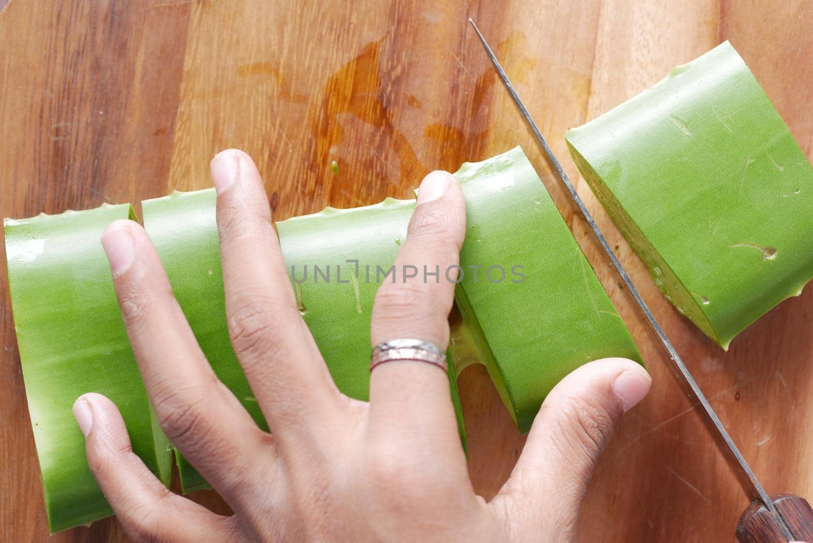 Close-up Fresh Aloe vera sliced on a chopping board.
