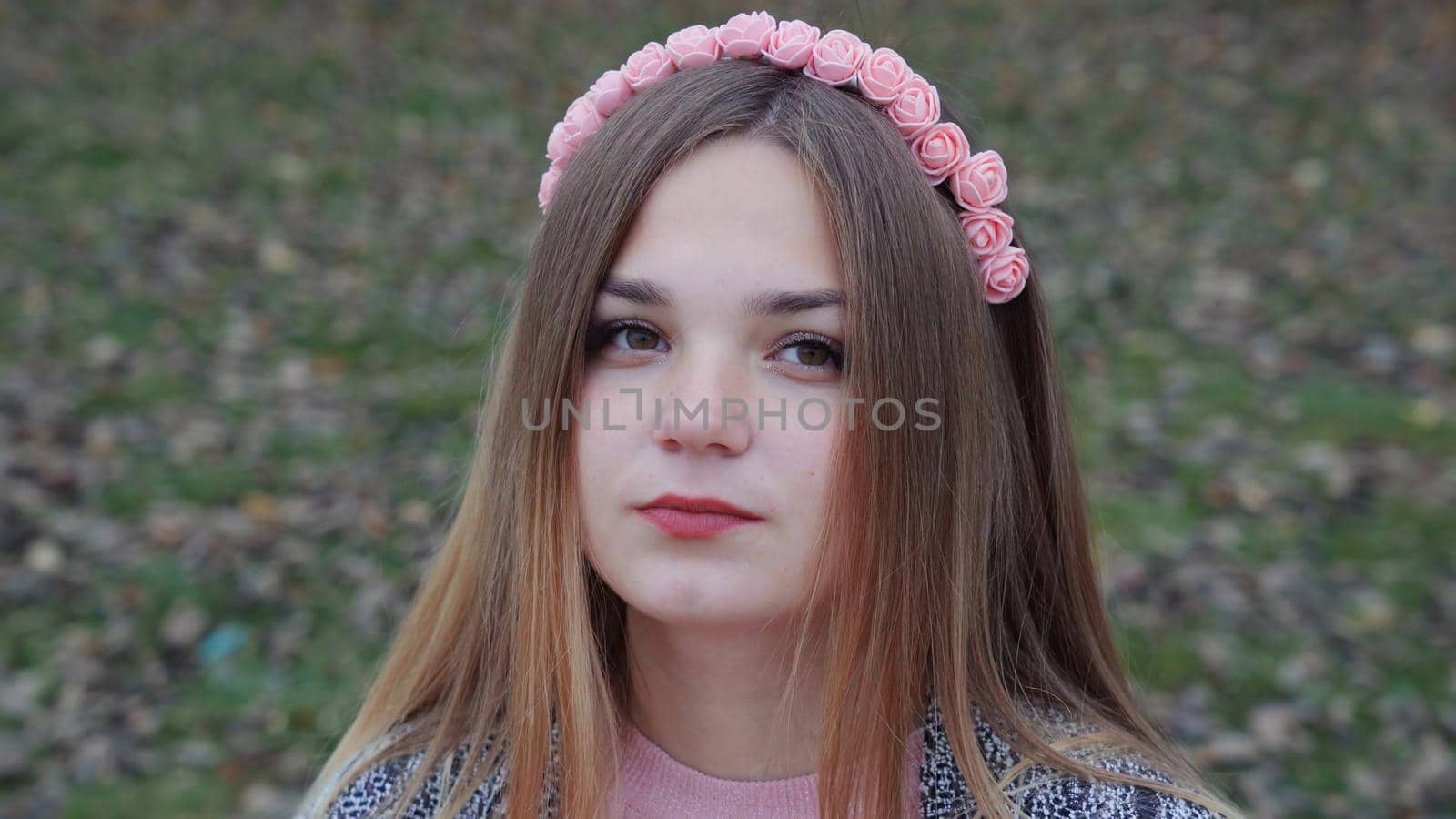 Beautiful girl posing in autumn evening. Face close-up. by DovidPro