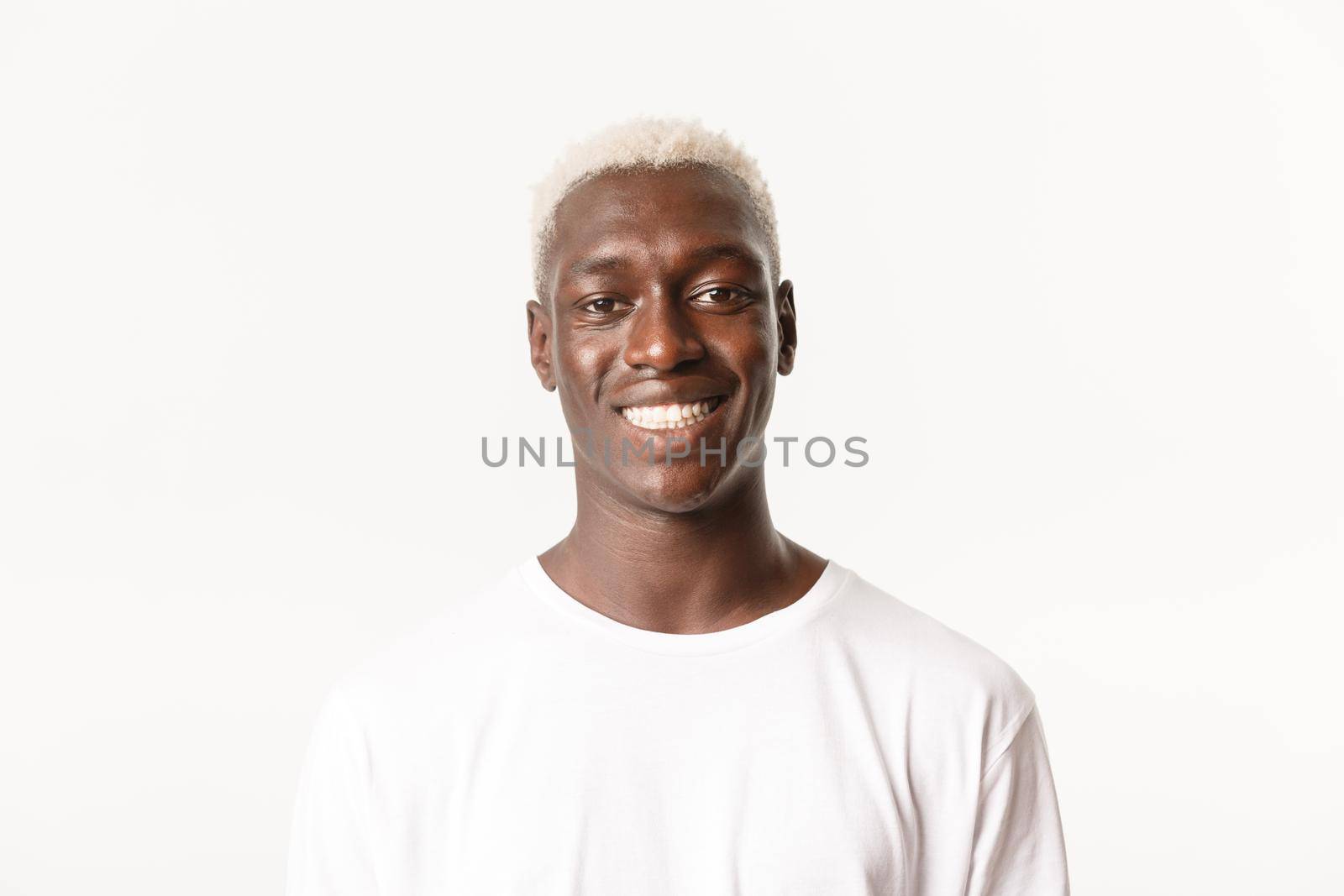Close-up of cheerful handsome african-american blond man, smiling happy and standing over white background by Benzoix