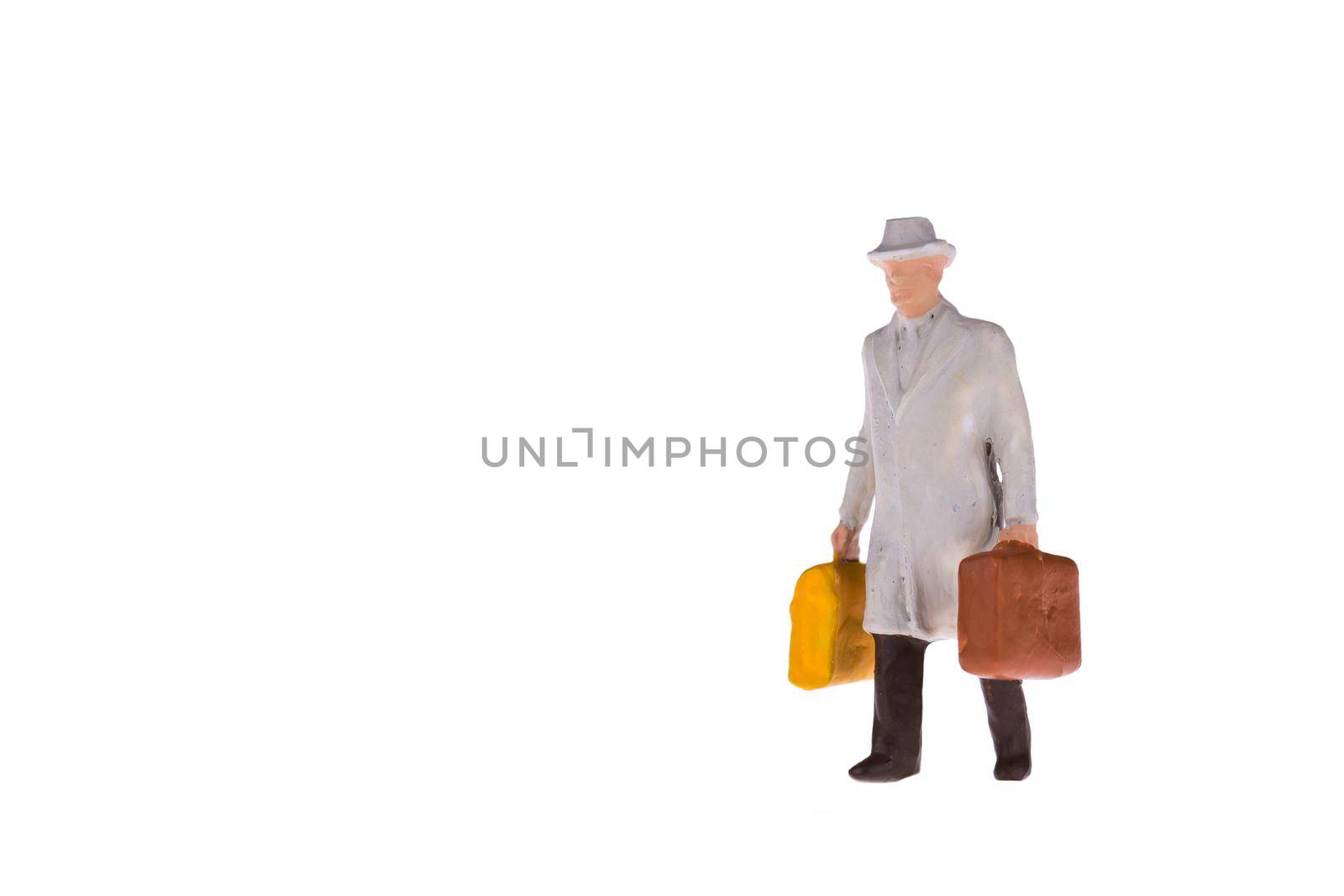 Close up of Miniature businessman and tourist people isolate on white background. Elegant Design with copy space for placement your text, mock up for travel concept by Nuamfolio