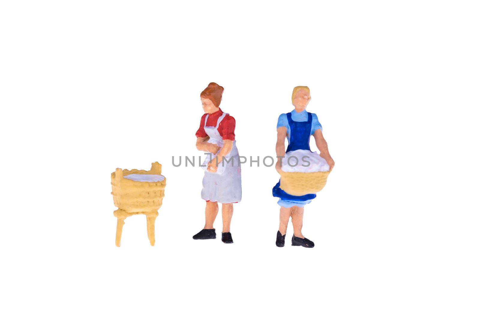 Close up of Miniature people isolate on white background. Elegant Design with copy space for placement your text, mock up for laundry and house keeping concept by Nuamfolio
