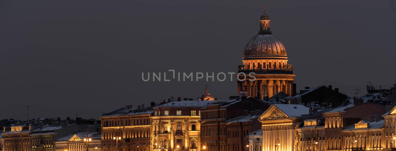 The panoramic footage of the winter night city Saint-Petersburg with picturesque reflection n water, Isaac cathedral on background, Blagoveshchensky bridge, old name is the lieutenant Schmidt. High quality photo