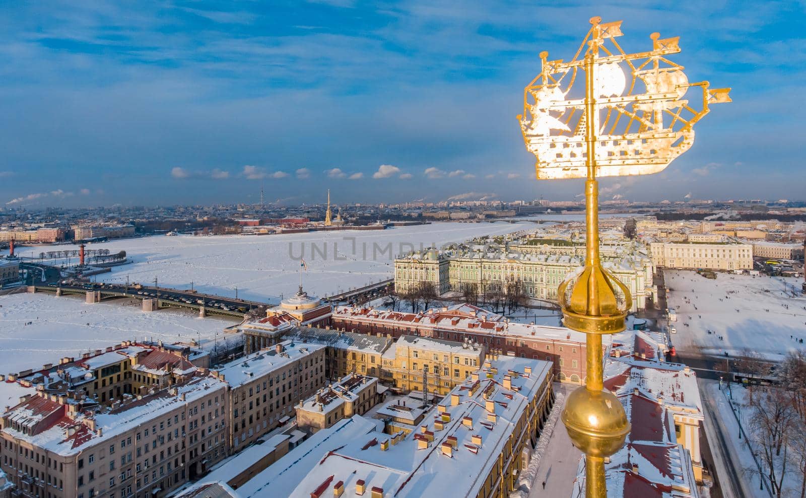 Aerial view of a golden spike with a gold symbol of the city Saint Petersburg, the building Admiralty in the clear winter afternoon, Palace square and drawbridge, Peter and Paul fortress, Rostral. High quality photo