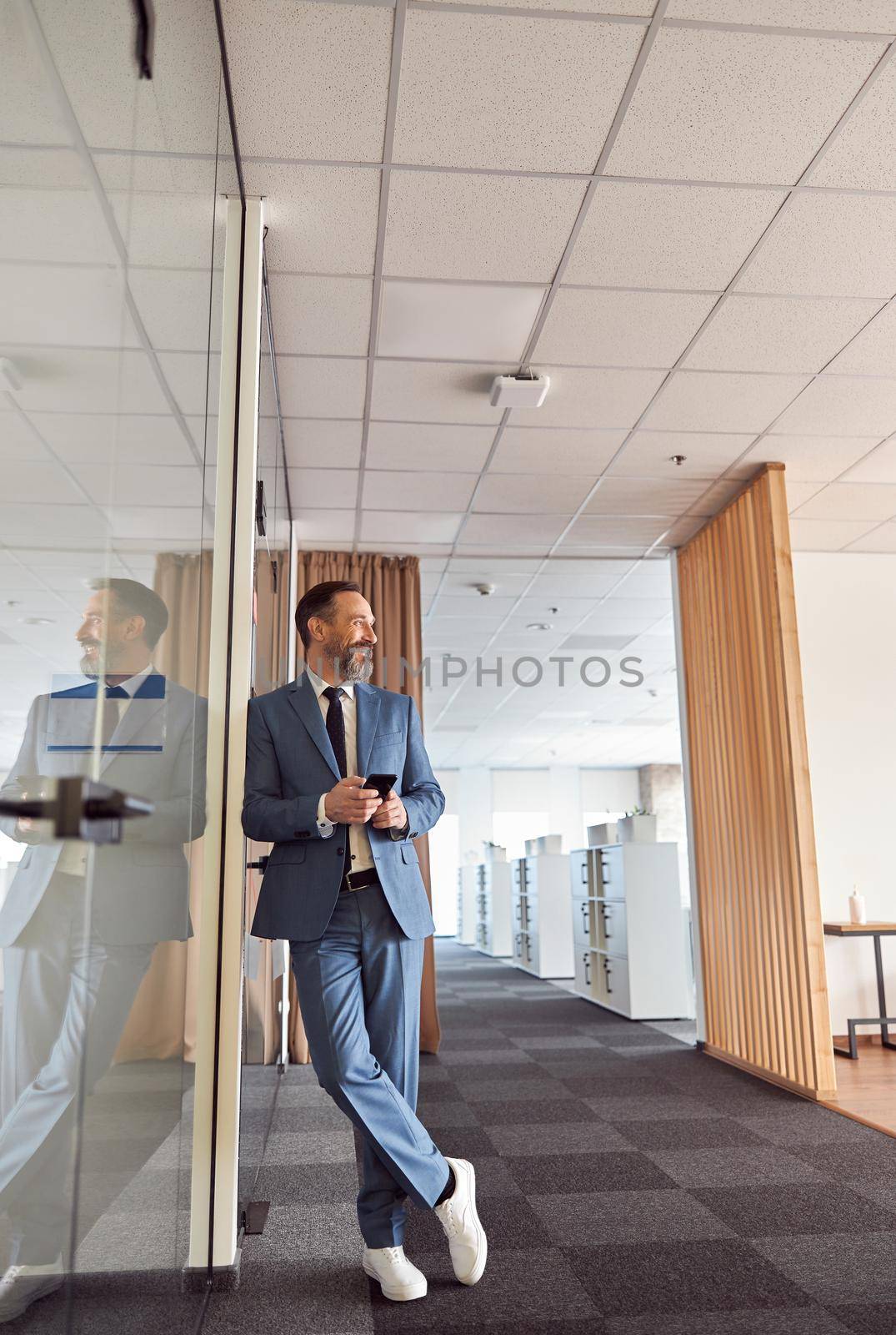 matured happy man at modern office