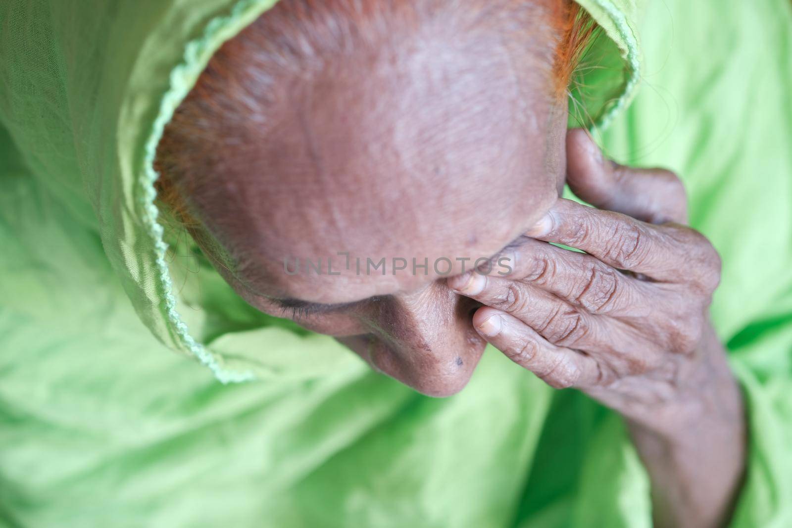 senior women suffering eye pain top view .