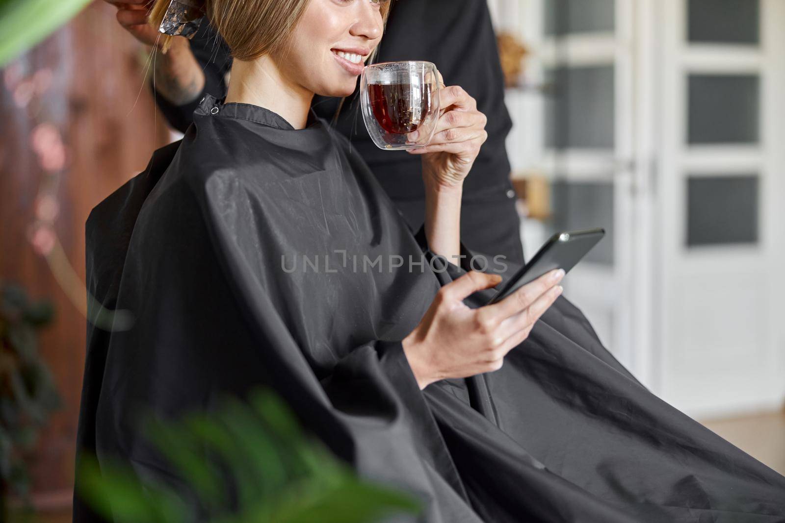 Happy beautiful light hair caucasian woman at beauty salon by Yaroslav_astakhov