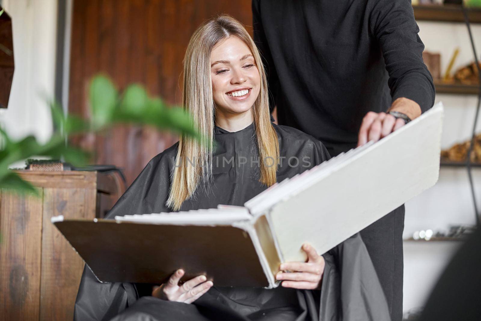 Happy beautiful light hair caucasian woman at beauty salon by Yaroslav_astakhov
