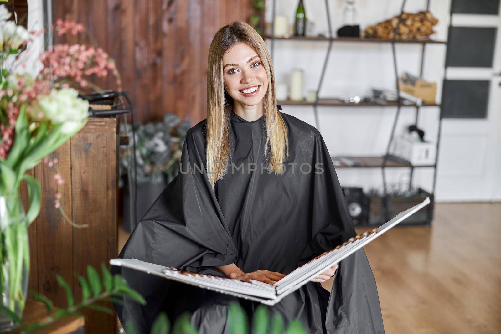 Happy beautiful light hair caucasian woman at beauty salon by Yaroslav_astakhov