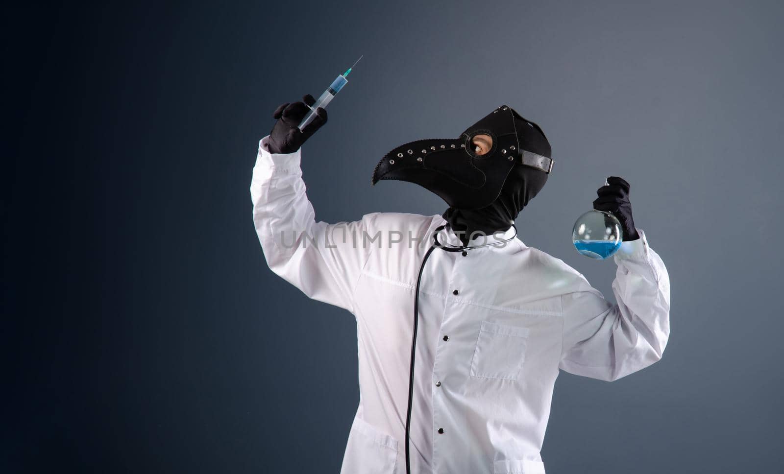 doctor in a dressing gown, in a plague doctor's mask, is vaccinating by Rotozey