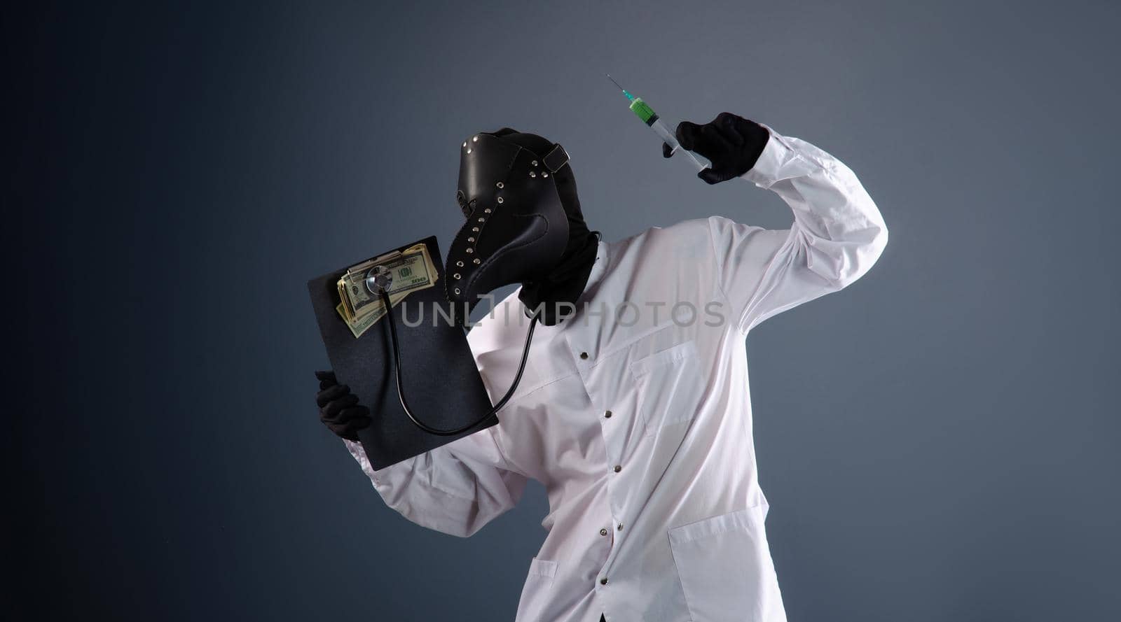 a doctor in a dressing gown, in a plague doctor's mask, is vaccinating