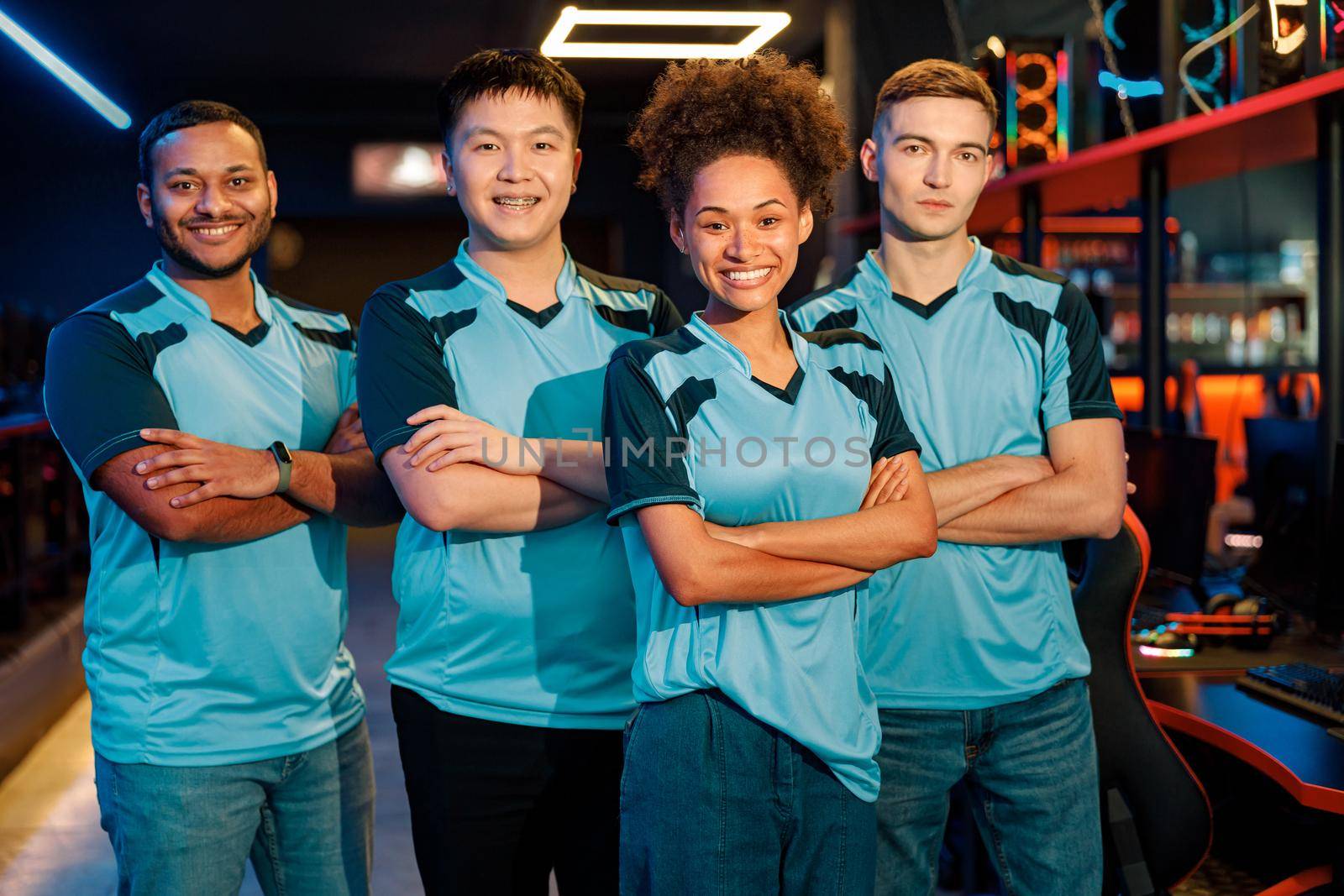 Professional team posing at camera in cyber club by Yaroslav_astakhov