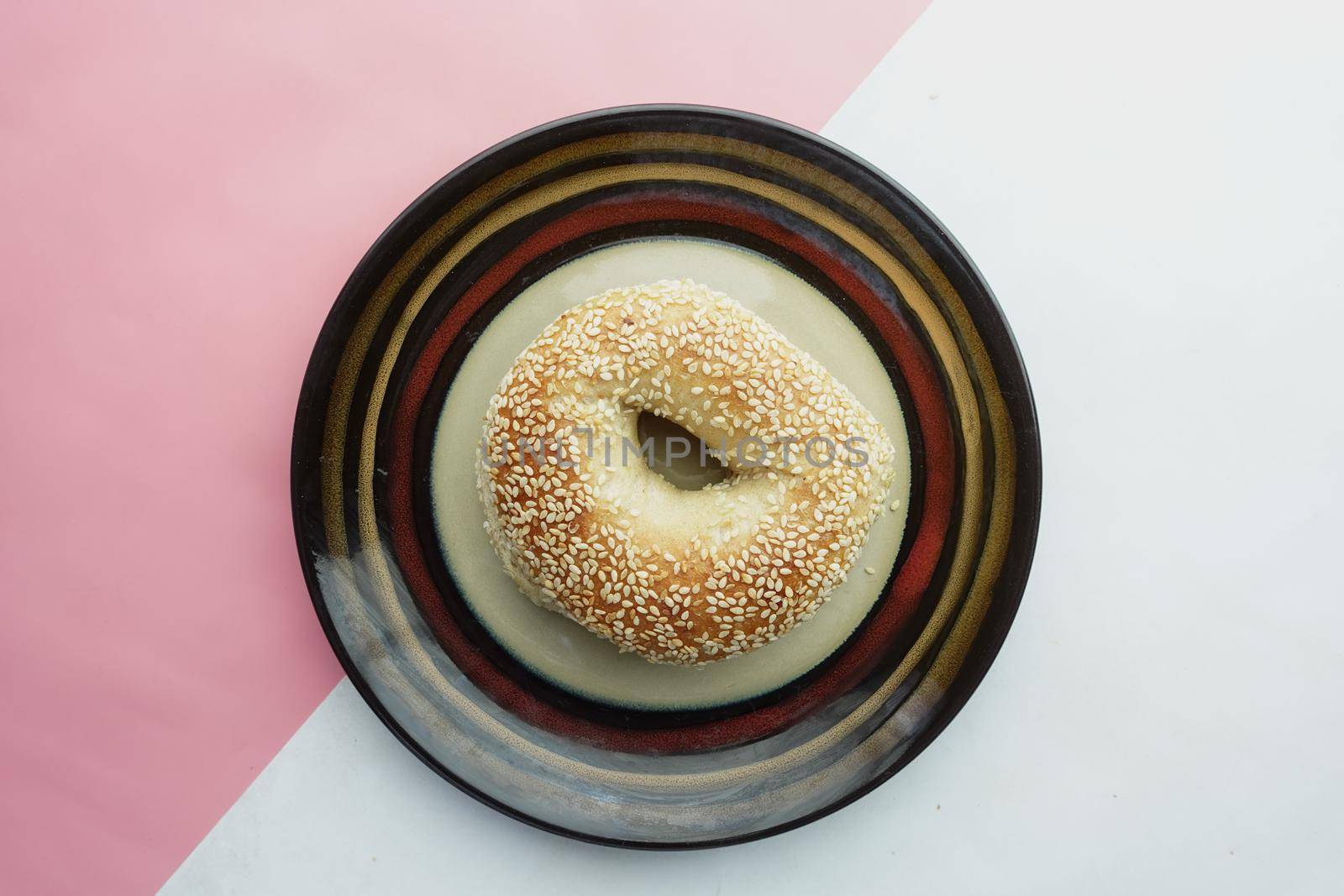 fresh bagel bread in a paper on table ,