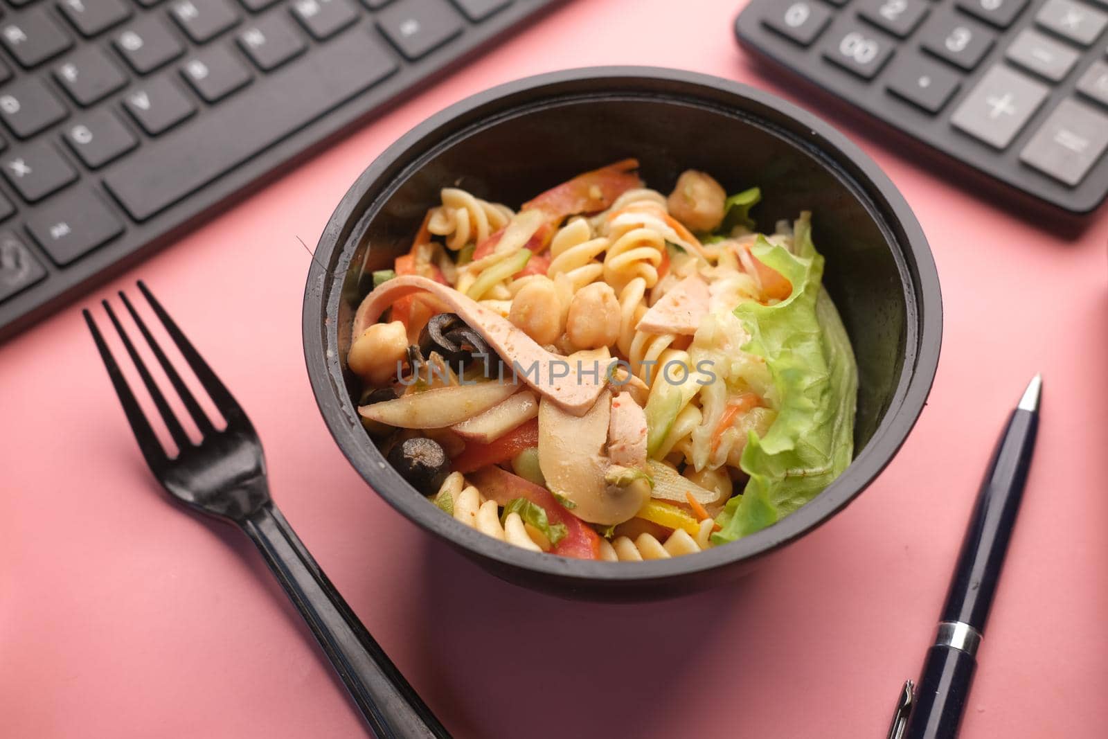 fresh vegetable salad in bowl on office desk ,