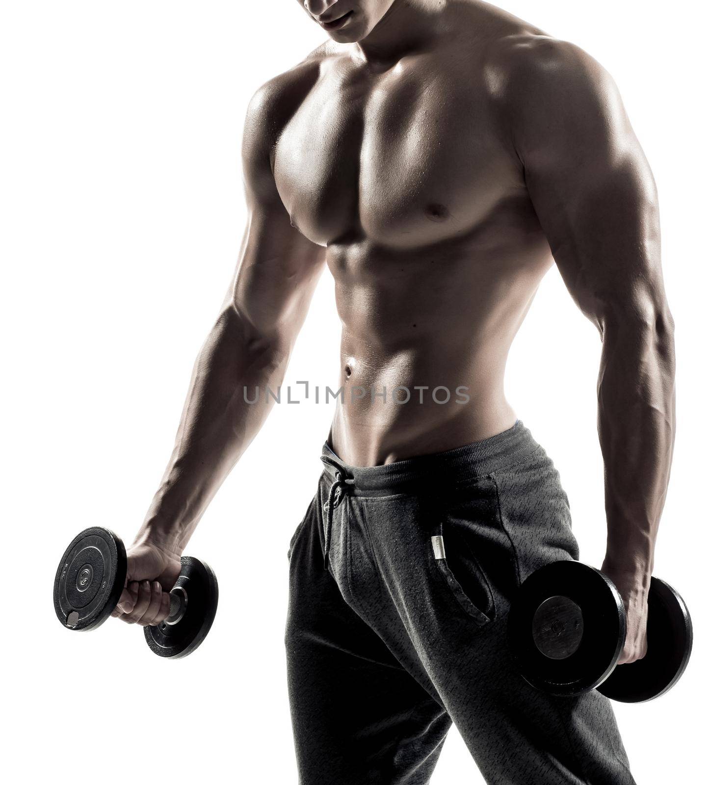 Handsome muscular man doing exercises with dumbbells isolated on white background Close up