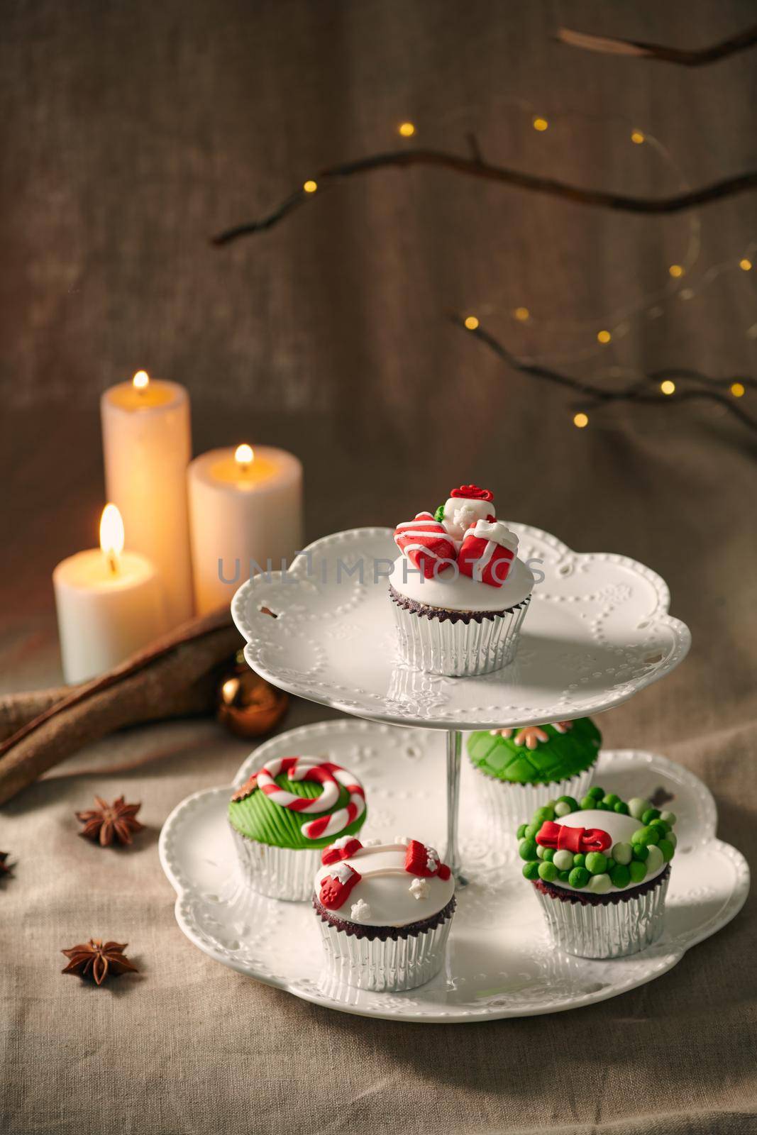 Christmas decoration on cupcakes, beautiful holiday background. by makidotvn