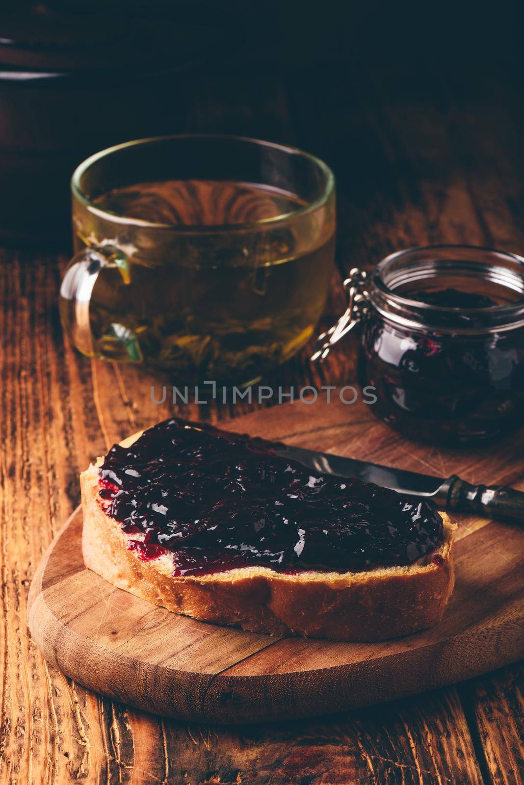 Toast with berry jam and green tea by Seva_blsv