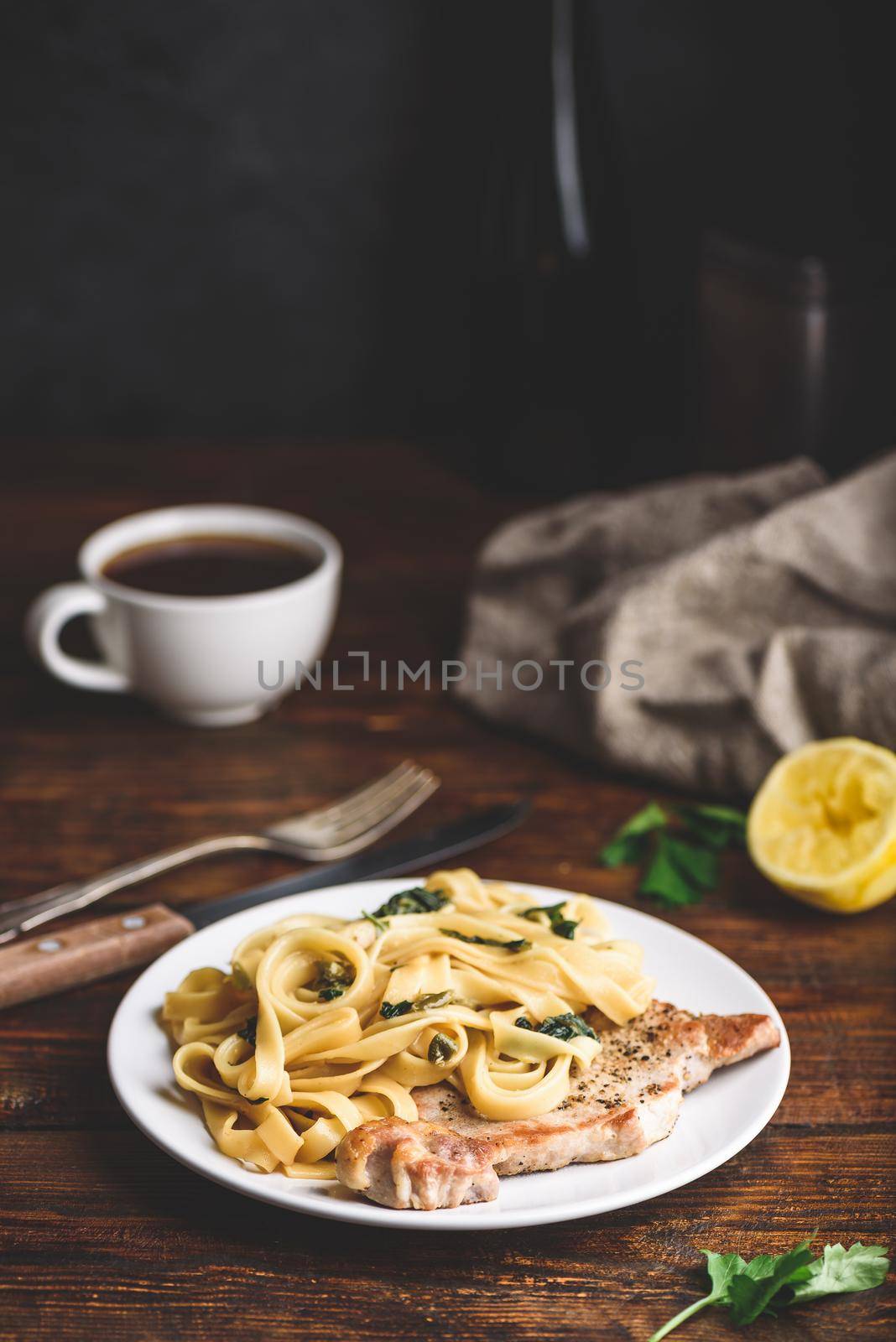 Pork chop steak with tagliatelle and capers by Seva_blsv