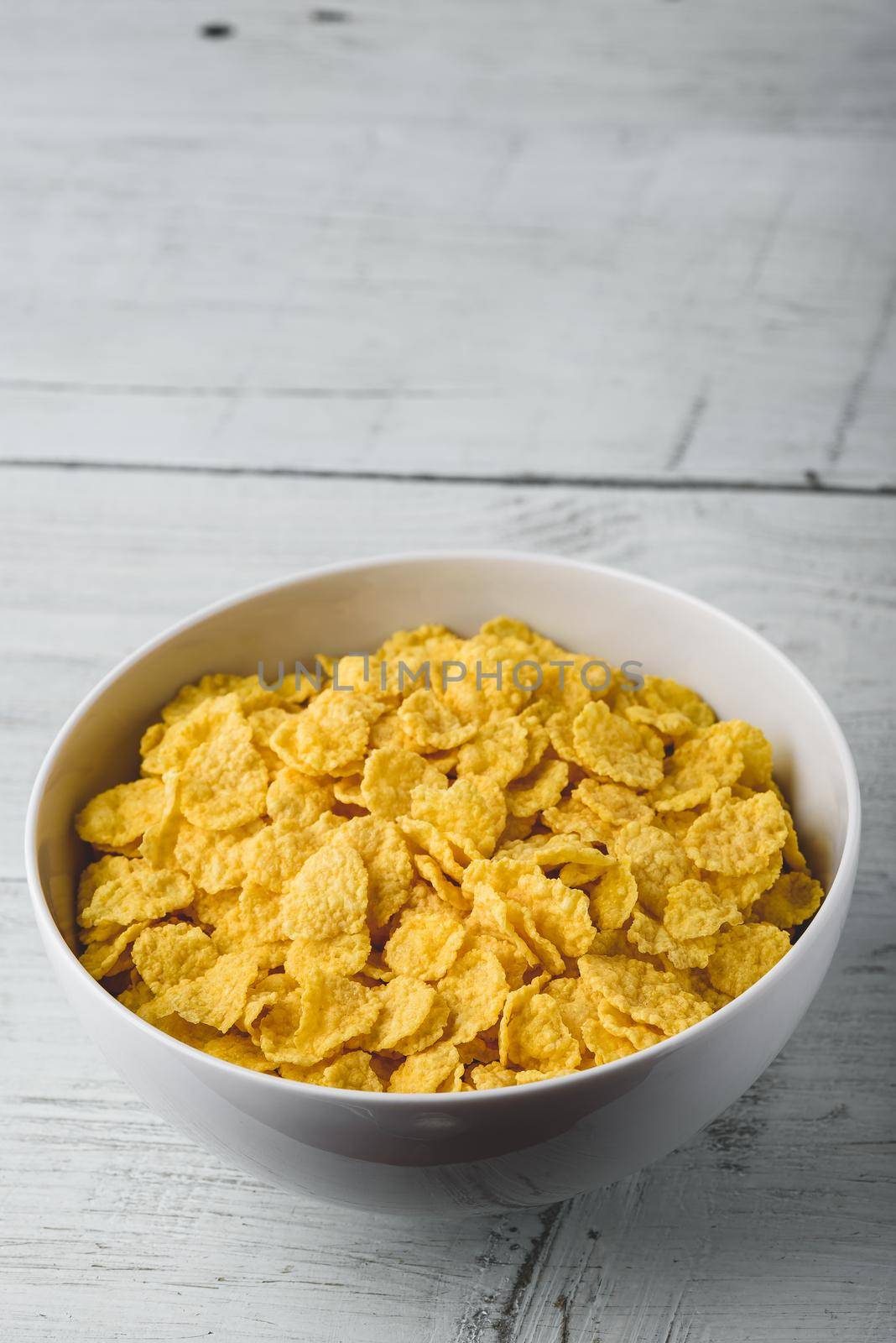 White bowl of corn flakes by Seva_blsv