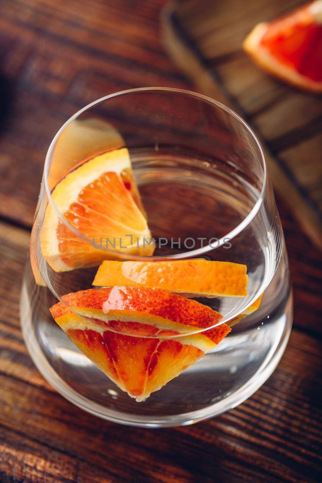 Detox water with blood oranges in drinking glass