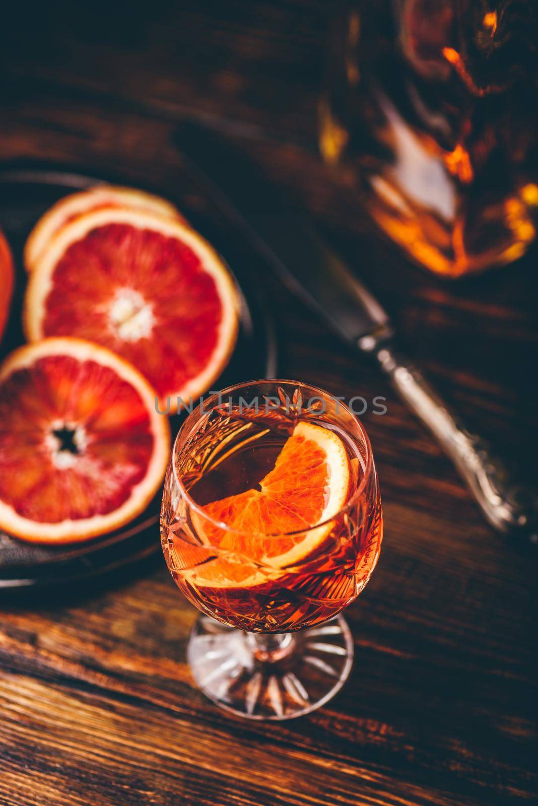 Whiskey sour cocktail with aged bourbon, blood orange juice and cherry syrup