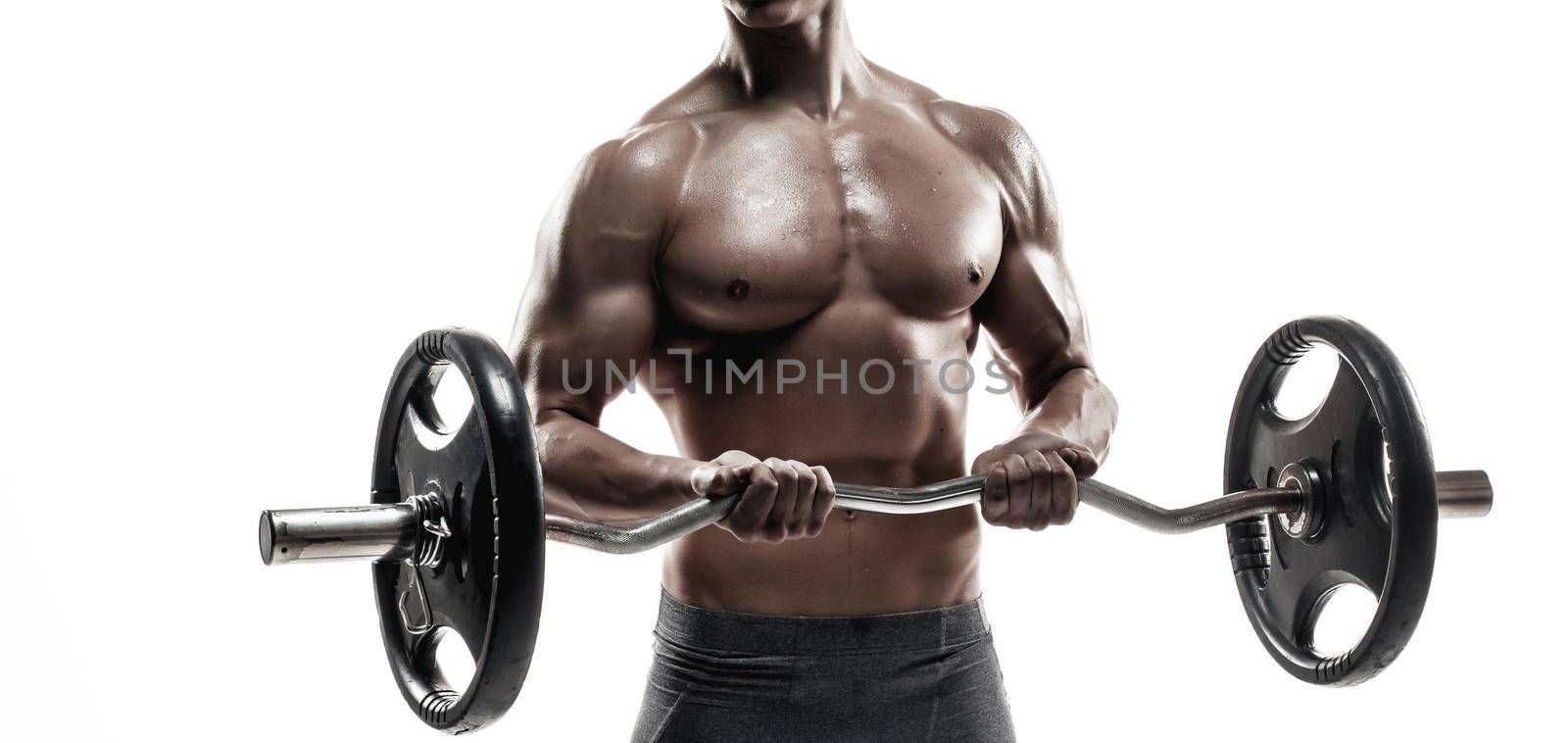 Young handsome man with naked torso and barbell by nazarovsergey
