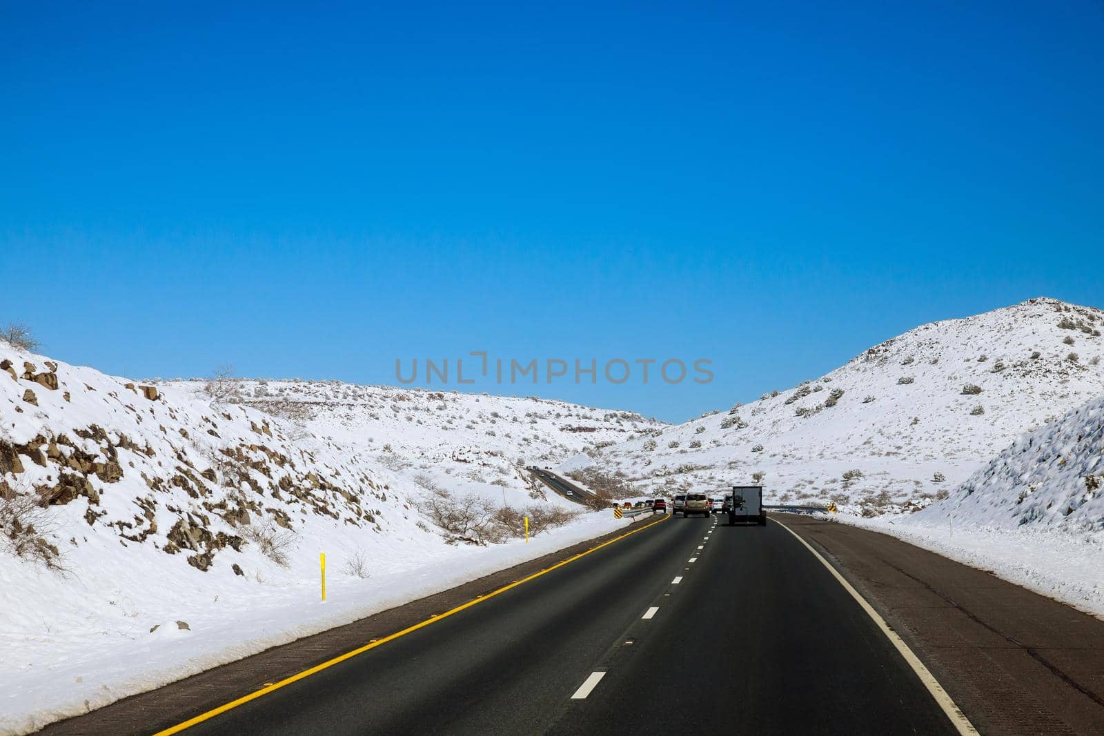 Freshly fallen fresh mountain snow Interstate 17 road in Arizona desert after the snowstorm