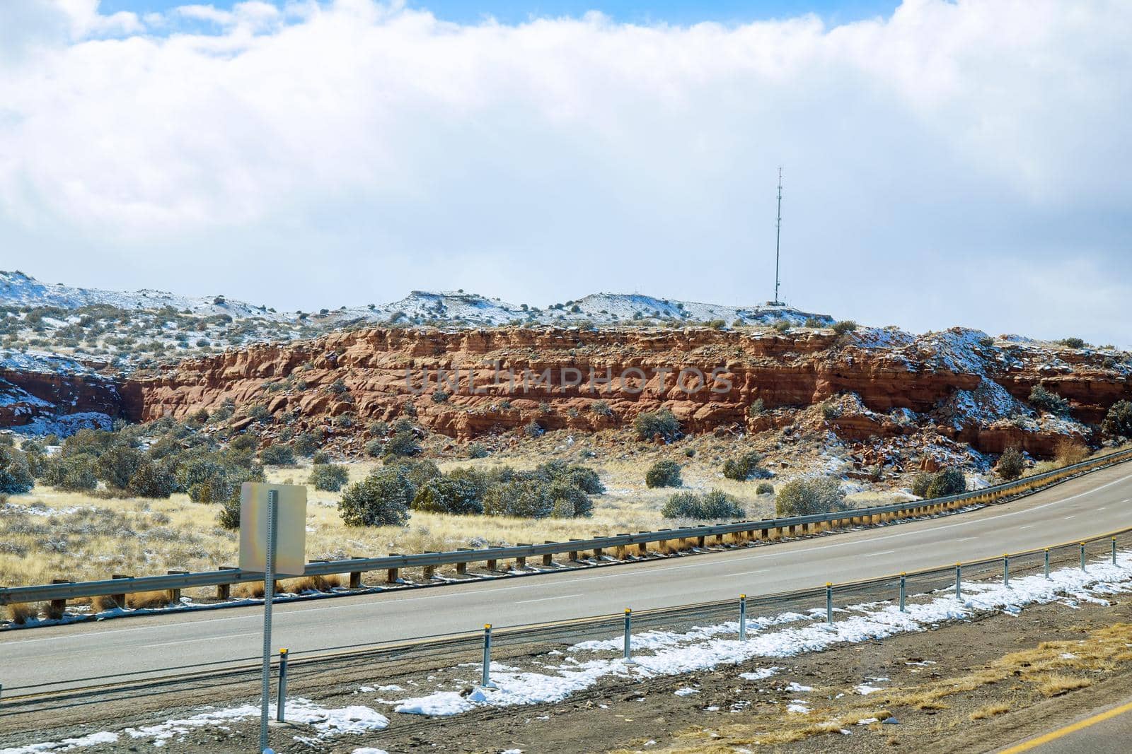 I-40 highway snow covered valley on overcast day in New Mexico by ungvar