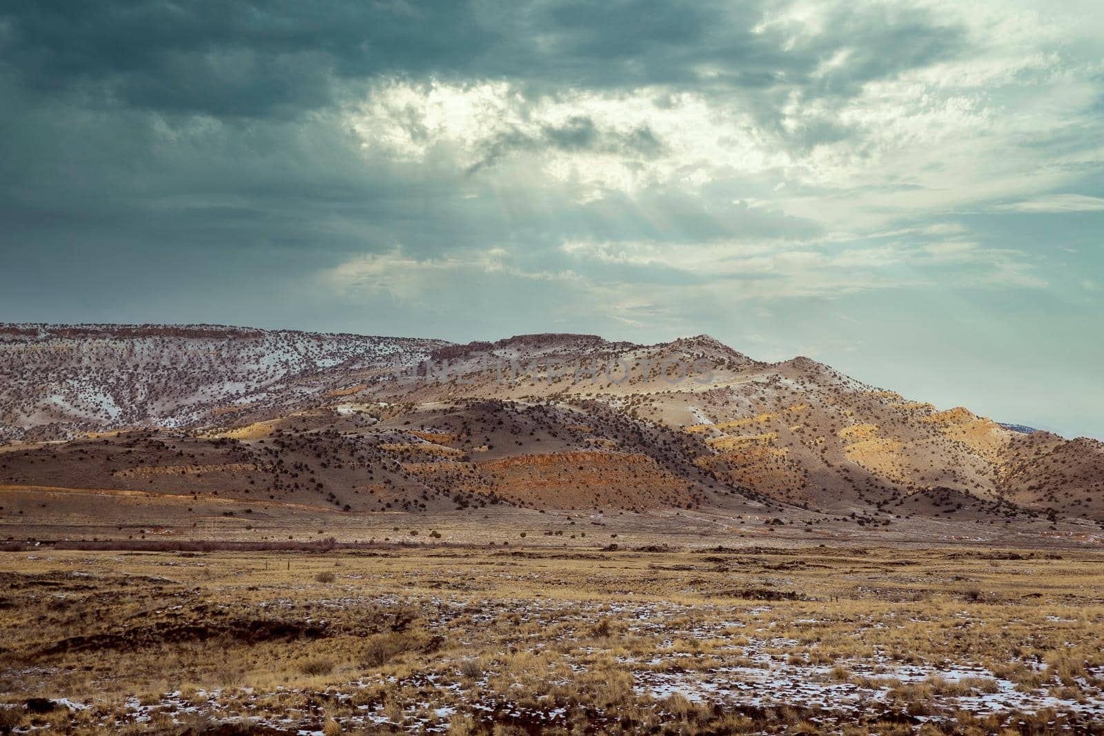 Snow covered of desert mountain in winter New Mexico by ungvar