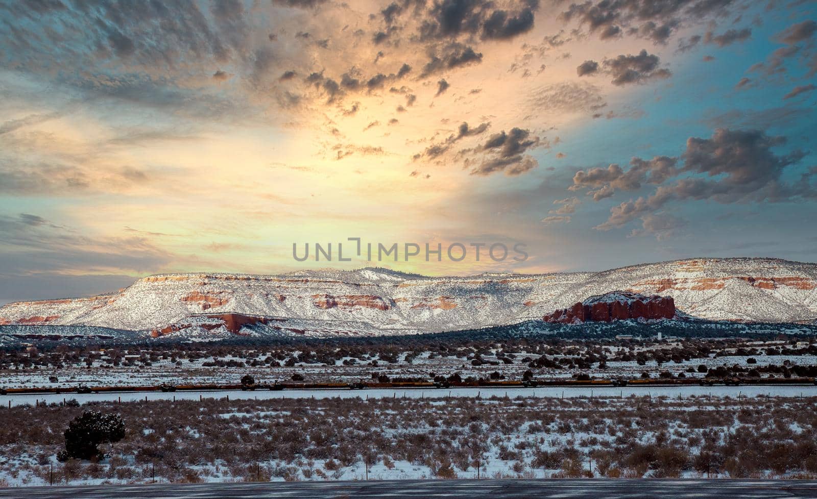 A view of snow-covered mountains, from along the I-40 highway in New Mexico US
