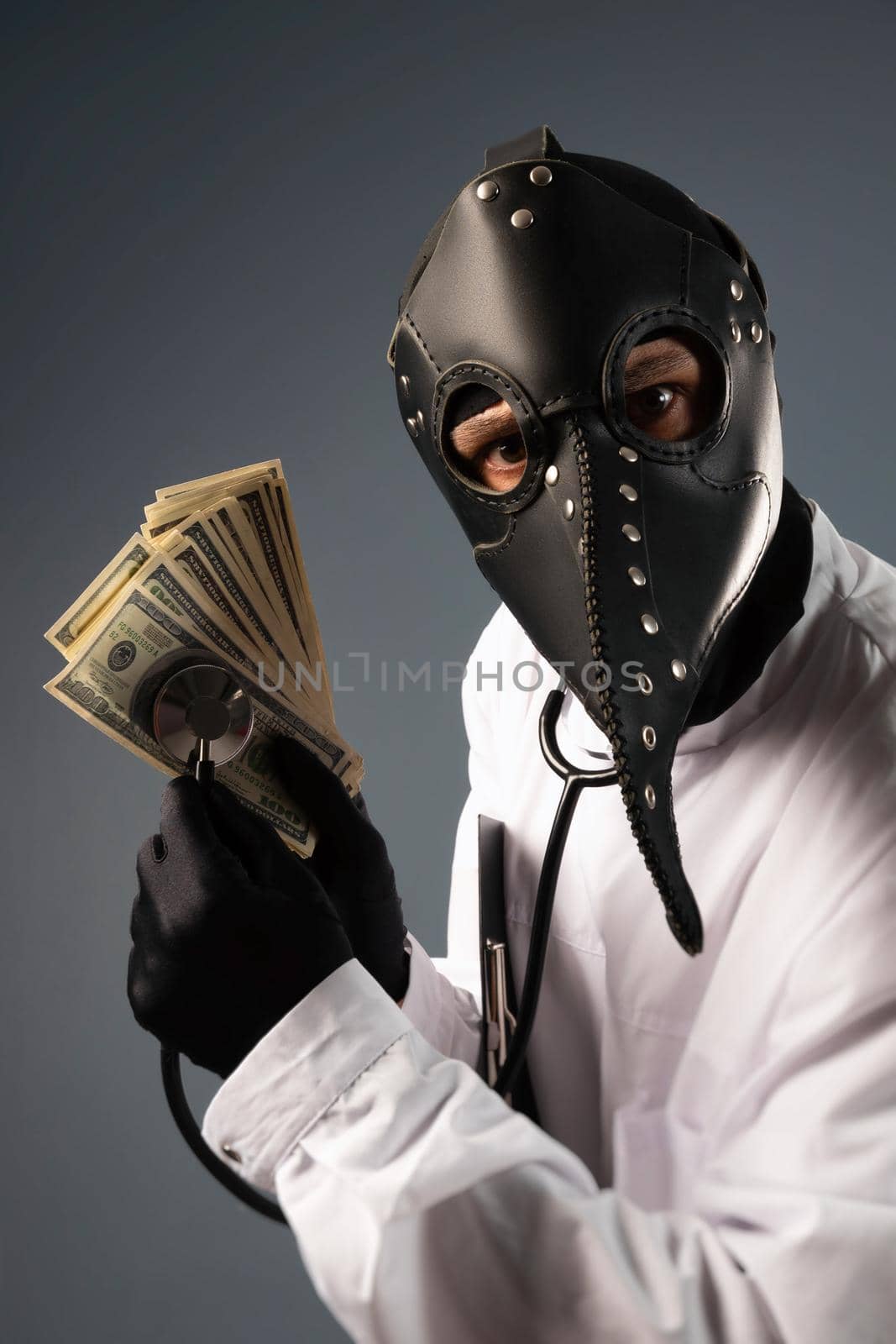 corrupt doctor in a bathrobe and a plague doctor mask with a wad of money in his hands