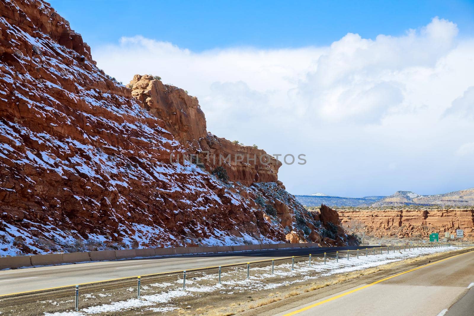 Winter landscape of desert mountain covered snow along the I-40 highway in New Mexico US