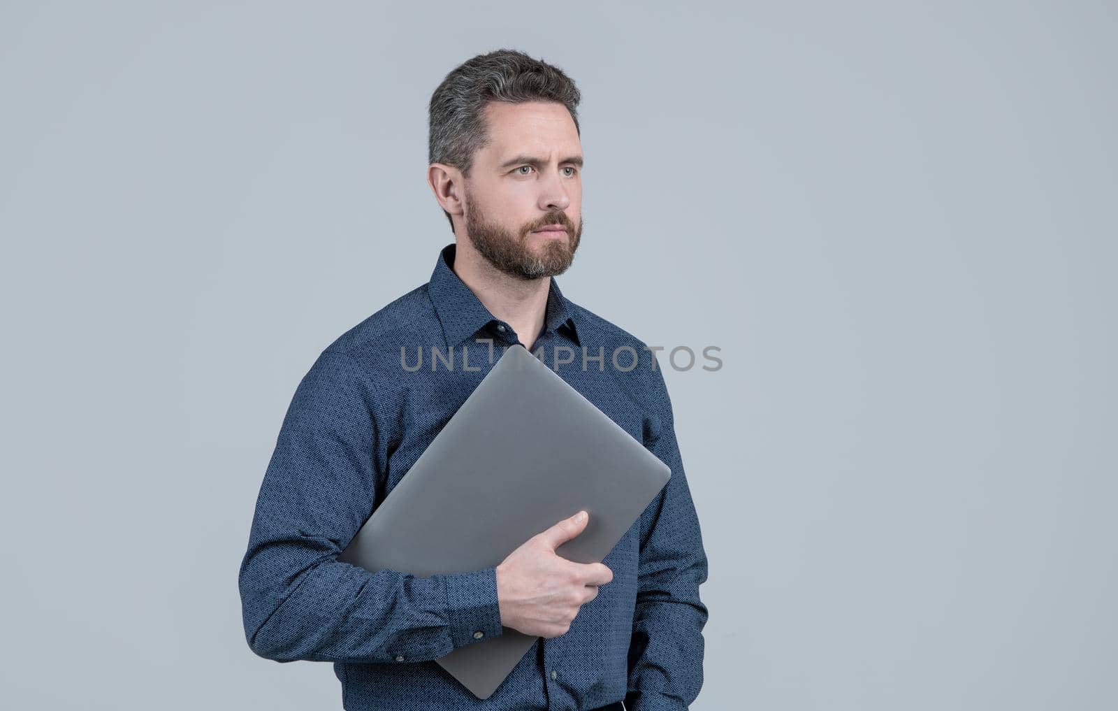 Virtual employee hold portable laptop computer for working online, technology, copy space by RedFoxStudio