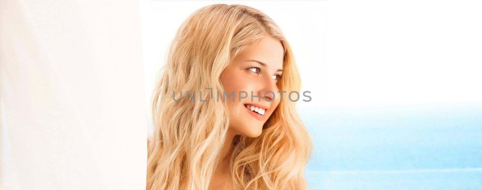 Beauty, wellness and summer portrait. Beautiful young woman with long blond hair, happy blonde smiling, blue sea on background by Anneleven