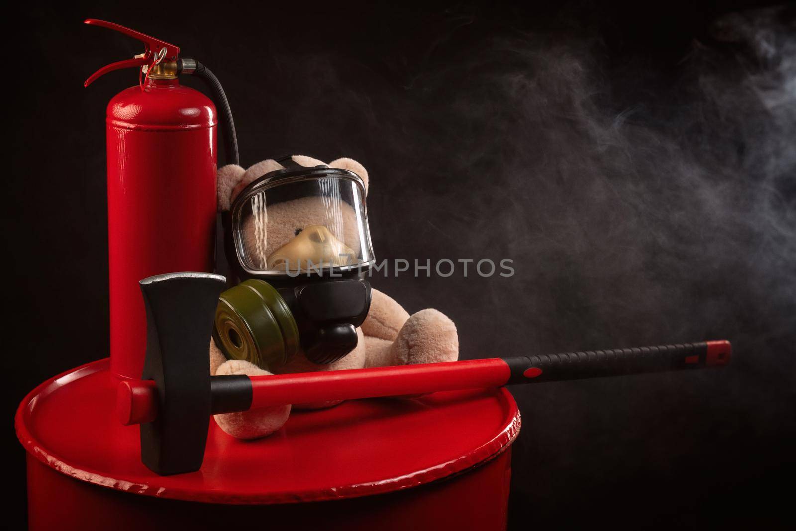 the mascot of the fire brigade is a teddy bear in a gas mask with a fire extinguisher and a red axe in smoke on a dark background by Rotozey