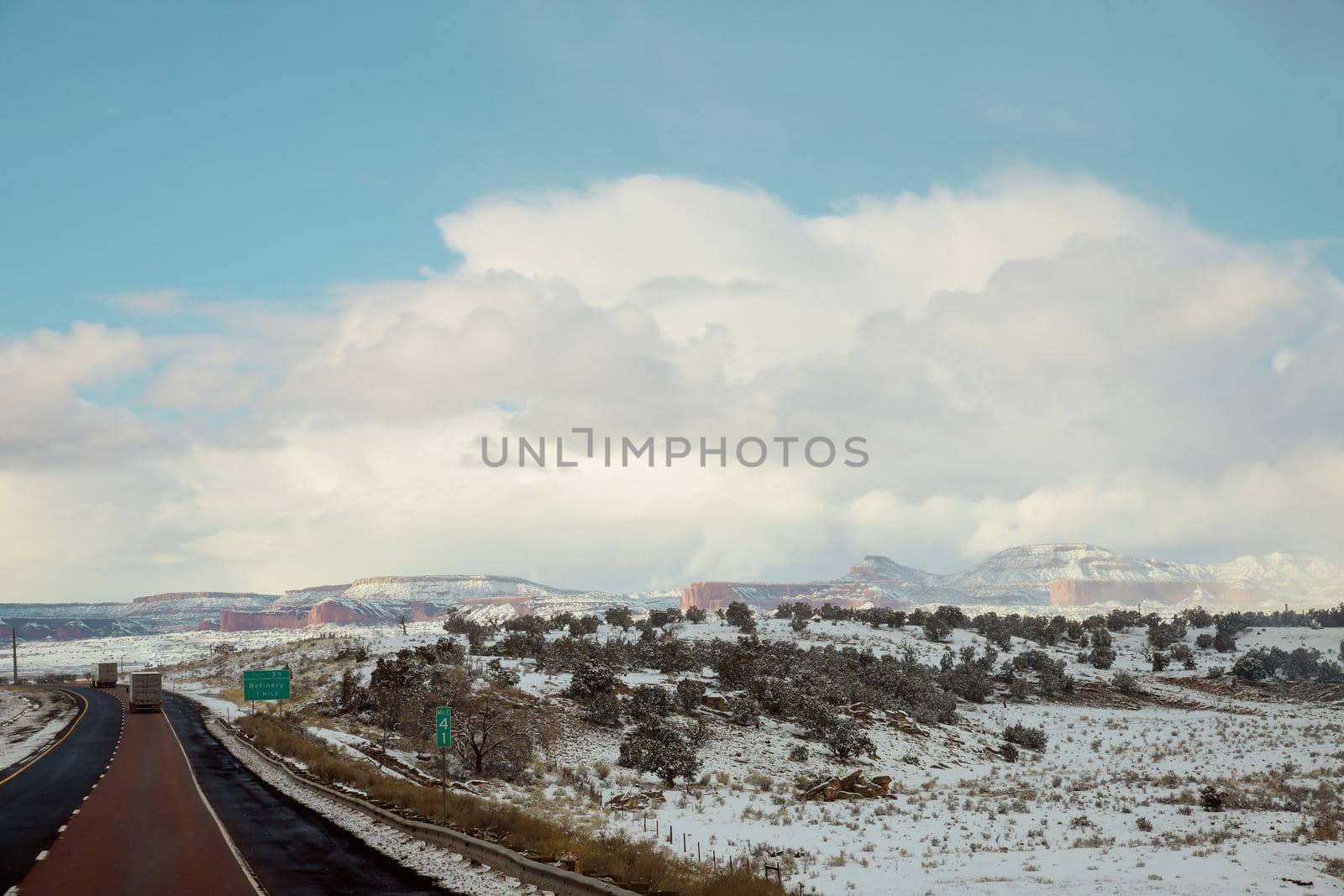 Winter landscape of desert mountain covered snow along the I-40 highway in New Mexico US