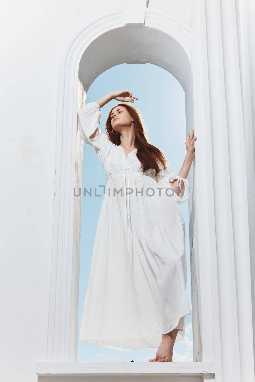 portrait of a woman in a white dress window opening luxury romance. High quality photo