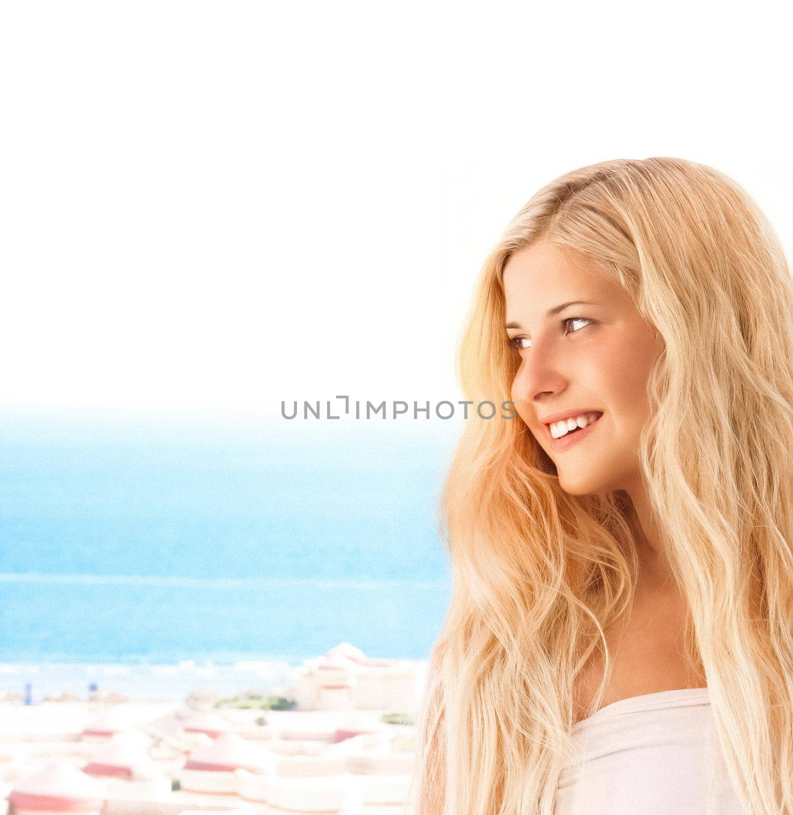 Beauty, wellness and summer portrait. Beautiful young woman with long blond hair, happy blonde smiling, blue sea on background.