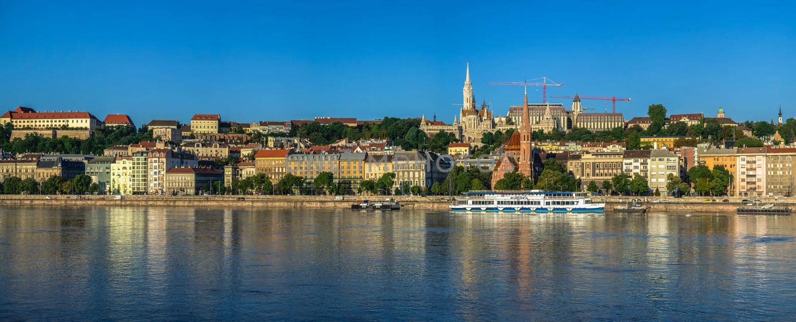 Budapest, Hungary 18.08.2021. Panoramic view of the Danube river and the embankment of Buda on a sunny summer morning