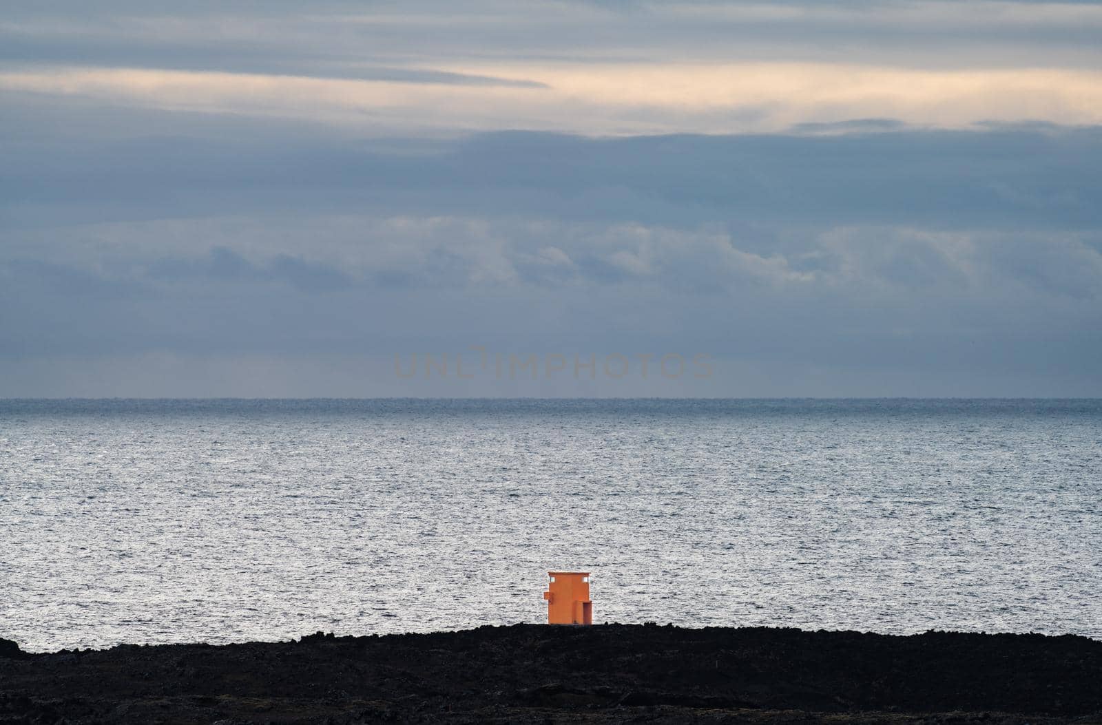 Orange tiny lighthouse facing the huge ocean by FerradalFCG