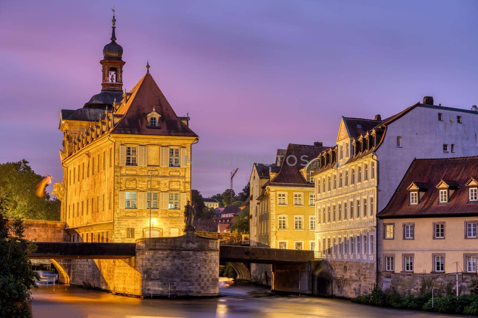 The Alte Rathaus and the river Regnitz in Bamberg, Germany, at dawn