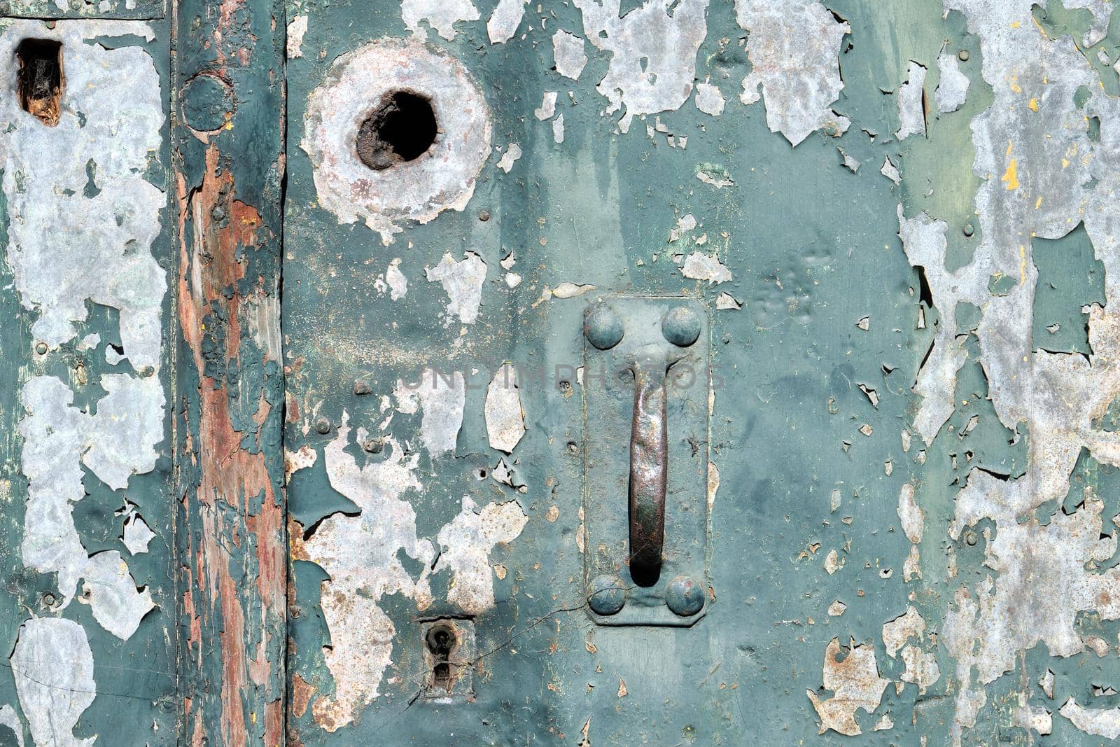 Old weathered door with peeling paint by elxeneize