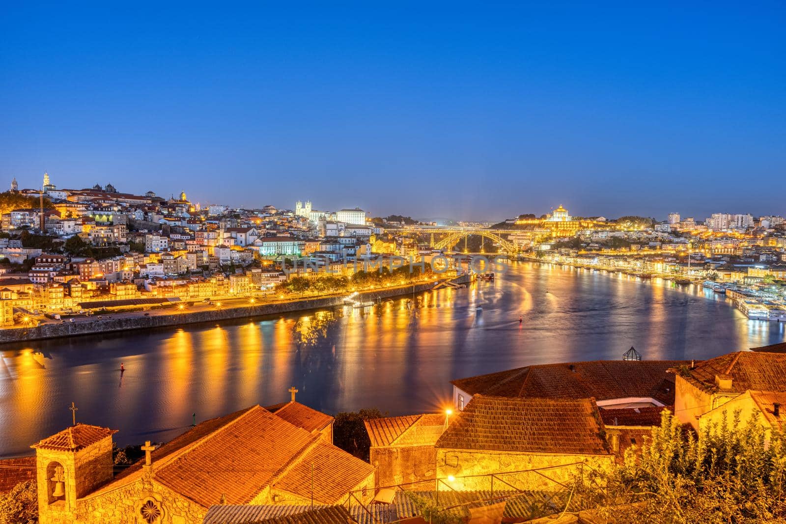 View of Porto at night by elxeneize