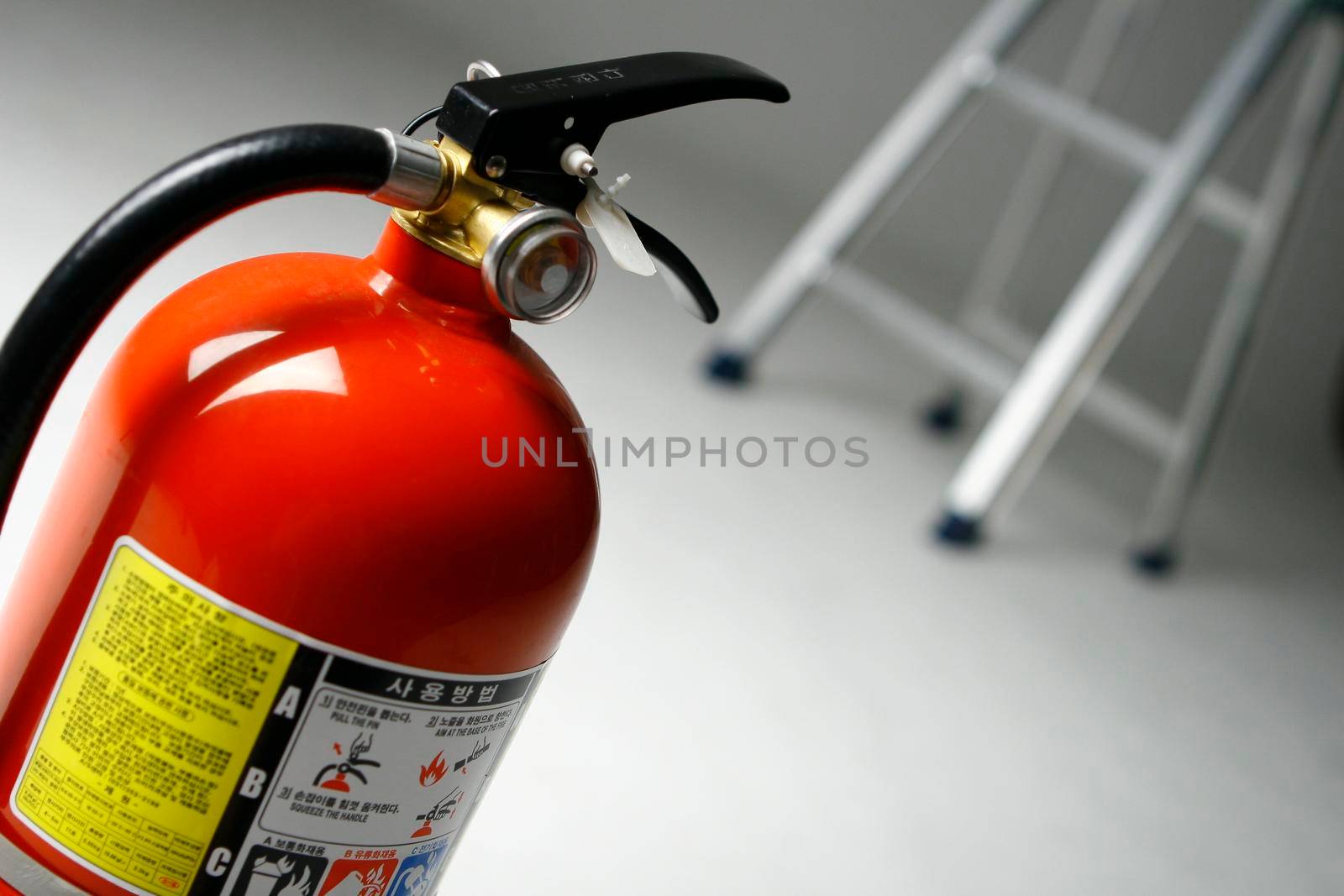Fire Extinguisher on white background by uphotopia