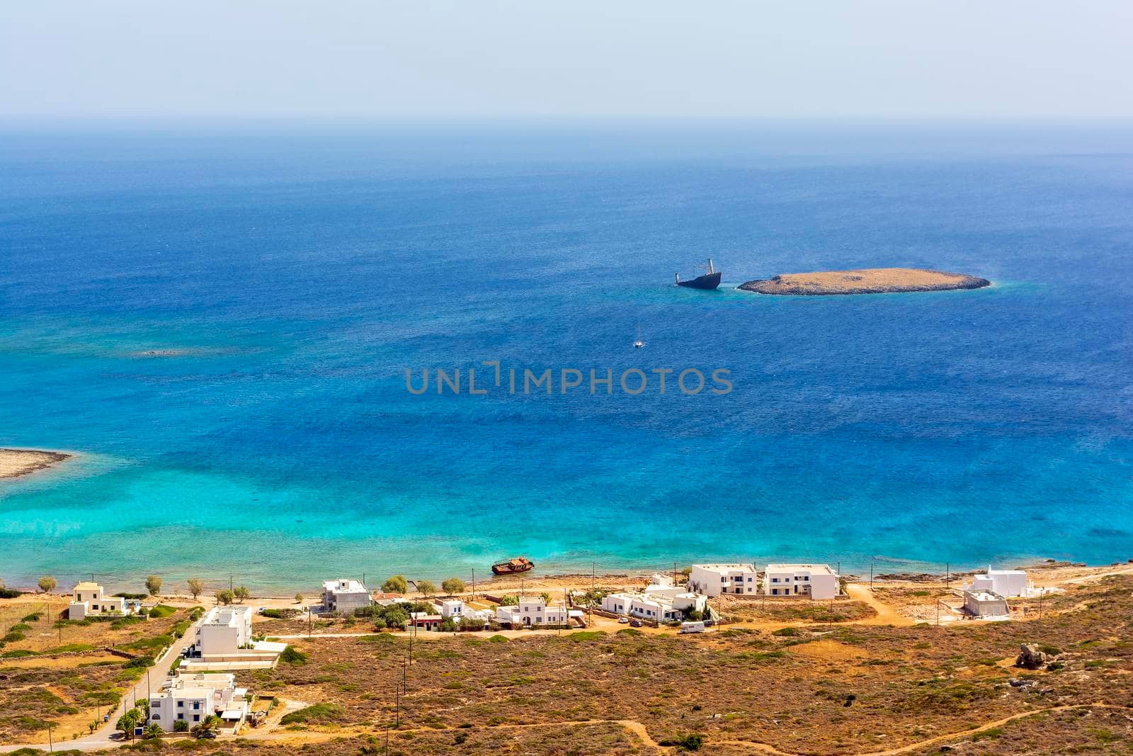 Diakofti port at the Greek island of Kythira. The shipwreck of the Russian boat Norland in a distance. by ankarb