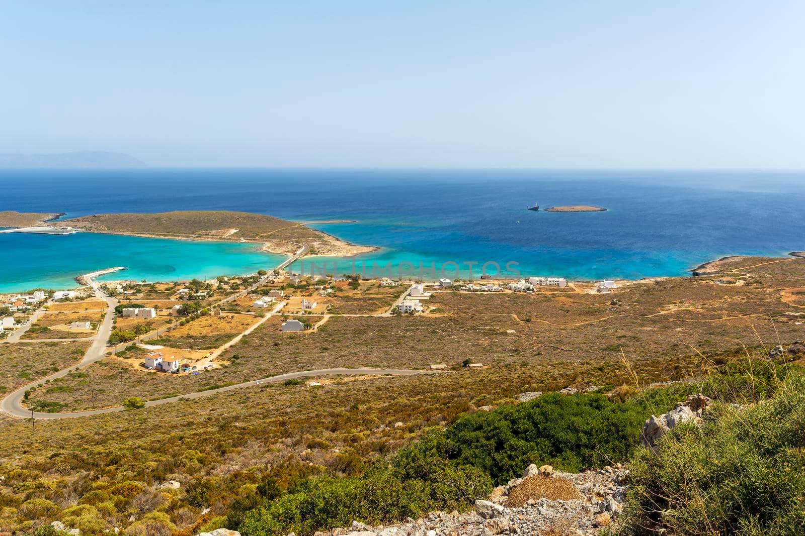 Diakofti port at the Greek island of Kythira. The shipwreck of the Russian boat Norland in a distance. by ankarb