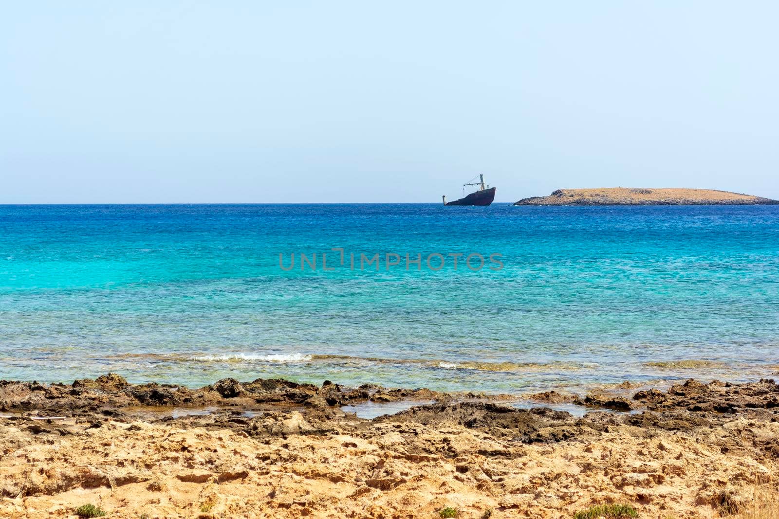 Diakofti port at the Greek island of Kythira. The shipwreck of the Russian boat Norland in a distance. by ankarb